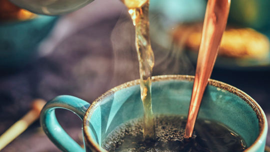 Tea pouring into mug