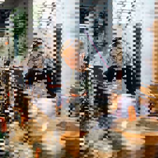 Woman Working Behind Bar